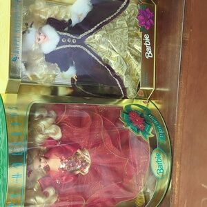 Set of two nib happy holidays barbie special edition.